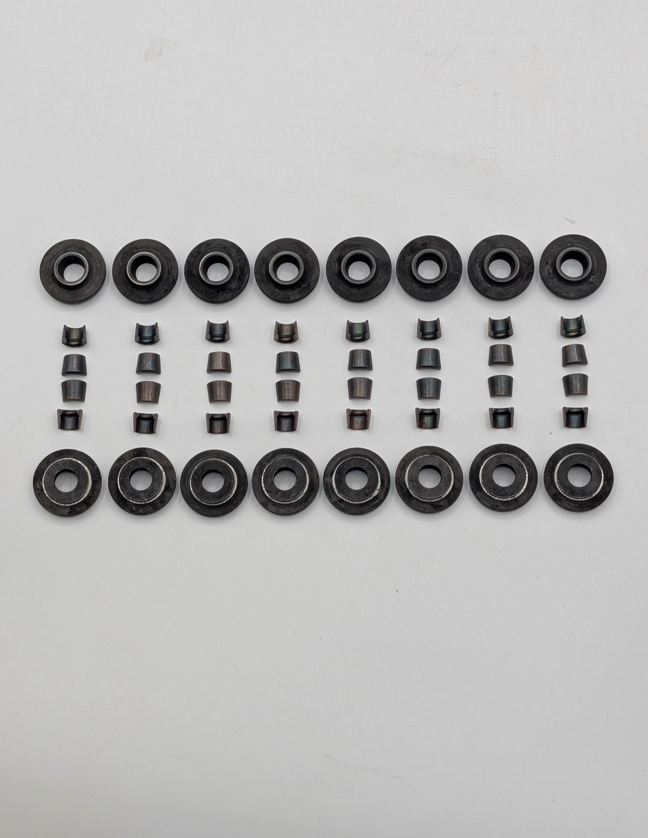 Steel retainers and split cones for cylinder head valves to one groove