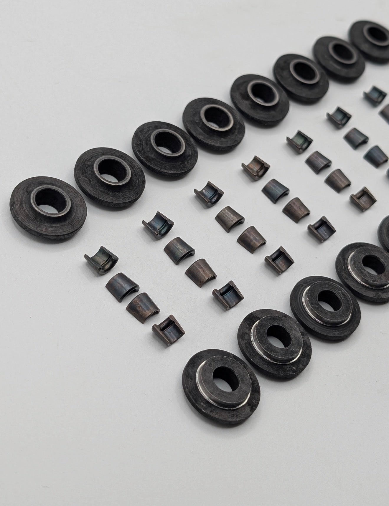 Steel retainers and split cones for cylinder head valves to one groove